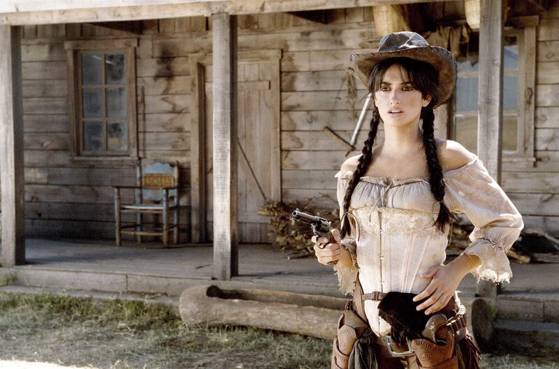 Woman Holding a Pistol — Brown, Dramatic
