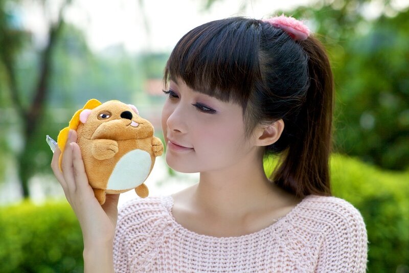 Woman holding a plush toy