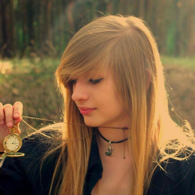 woman holding a pocket watch