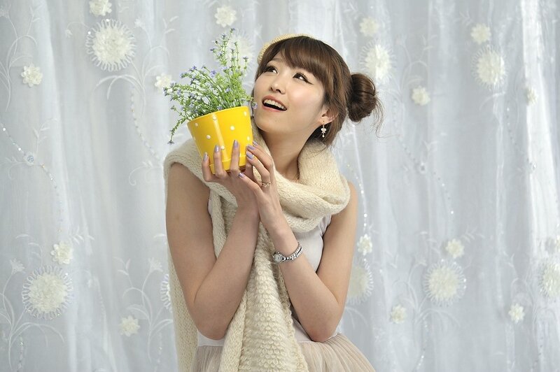 Woman holding a potted plant