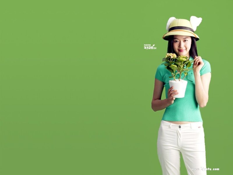 woman holding a potted plant