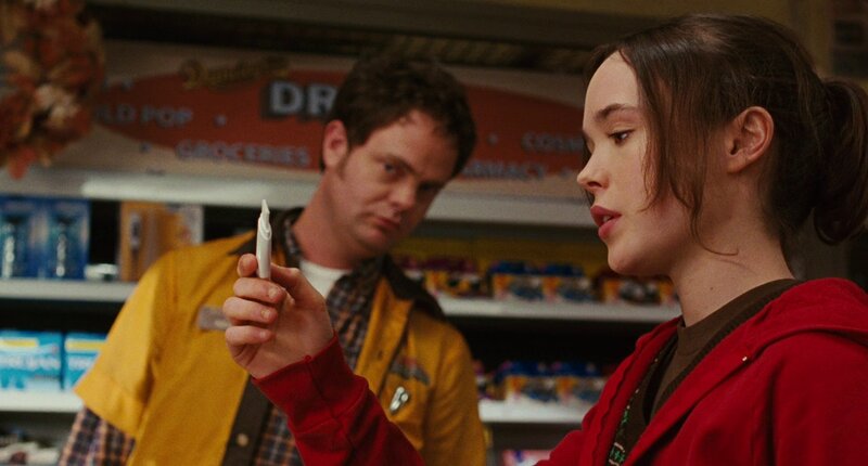 woman holding a pregnancy test
