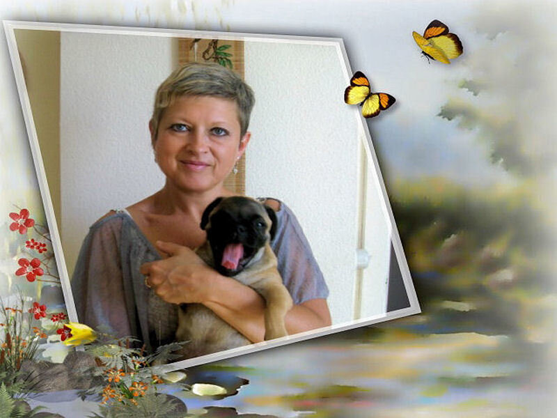 Woman holding a pug puppy