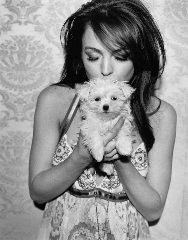 woman holding a puppy