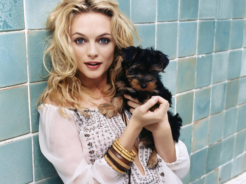 woman holding a puppy