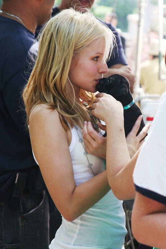 woman holding a puppy