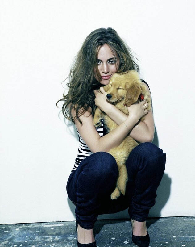 woman holding a puppy