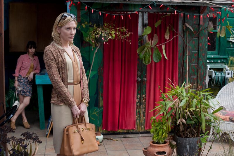 Woman holding a purse outside
