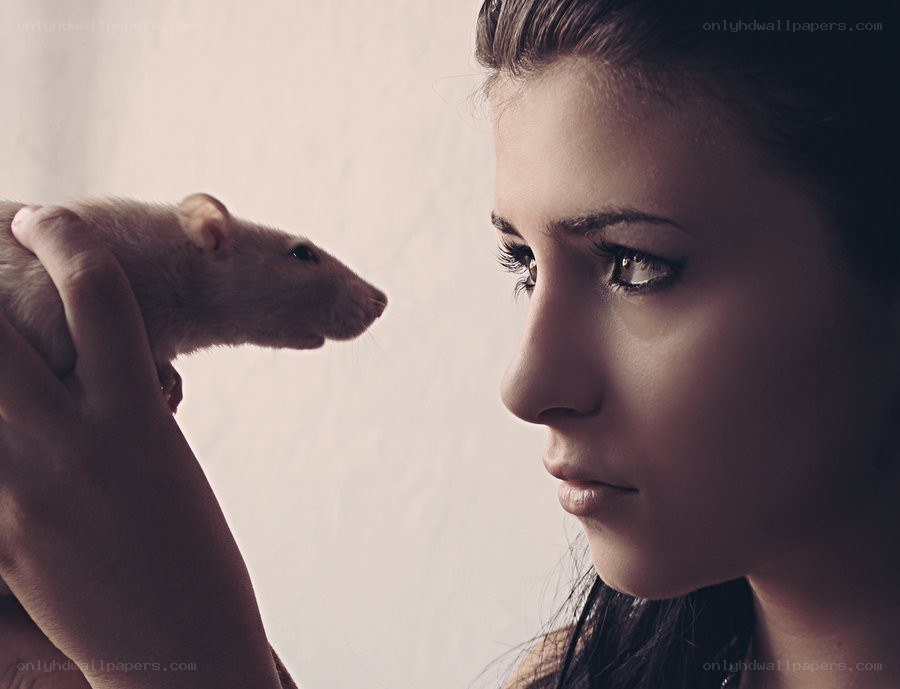 woman holding a rat