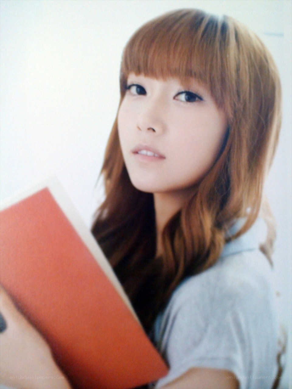 woman holding a red book