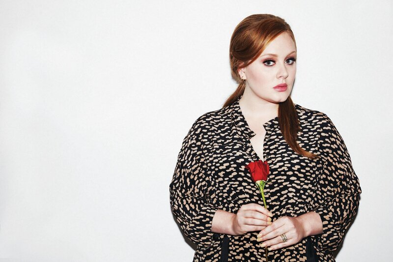 Woman holding a red rose