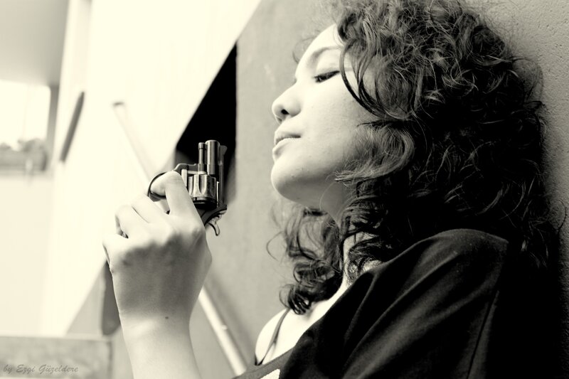 woman holding a revolver