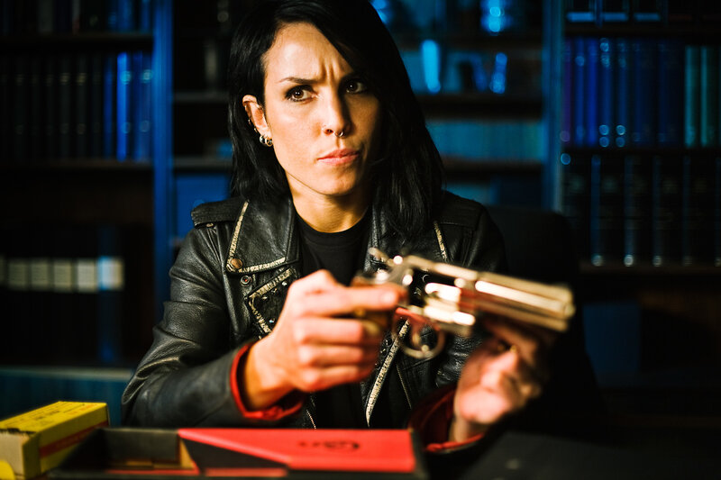 Woman holding a revolver