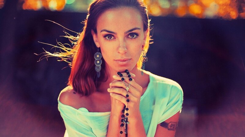 woman holding a rosary