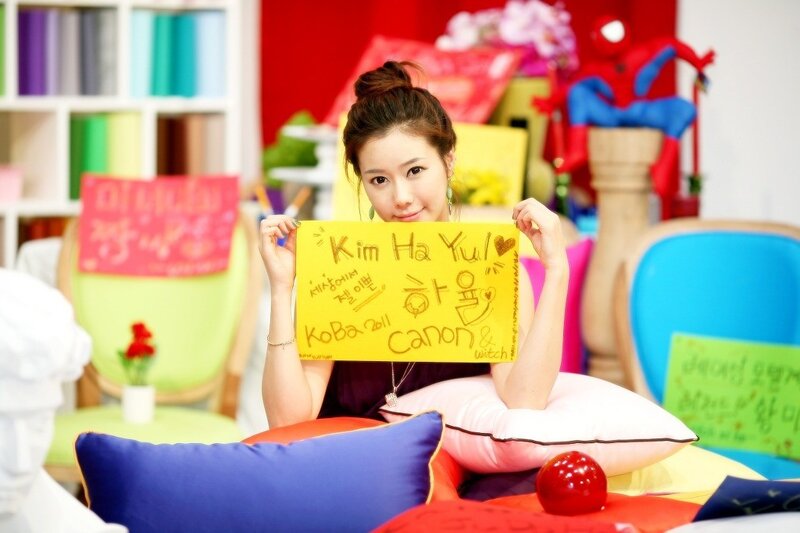 Woman holding a sign with her name