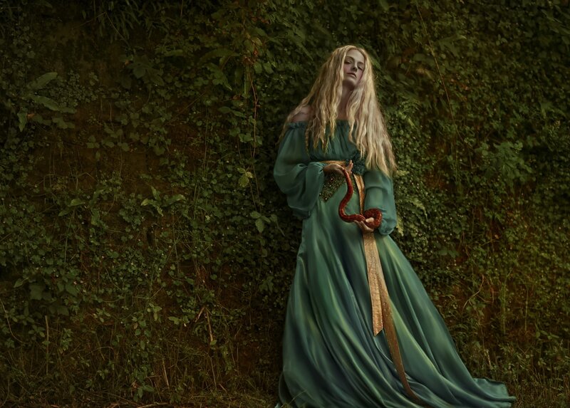 Woman Holding a Snake — Green, Dramatic, Photograph