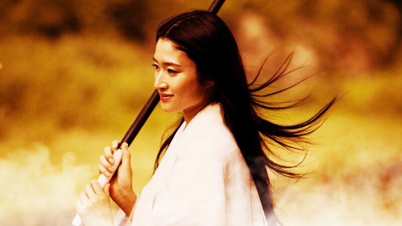 woman holding a staff
