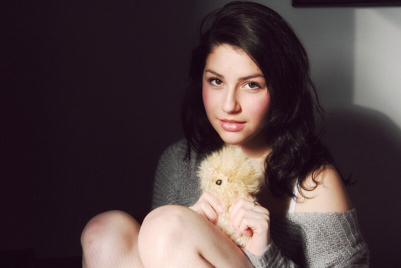 woman holding a stuffed animal
