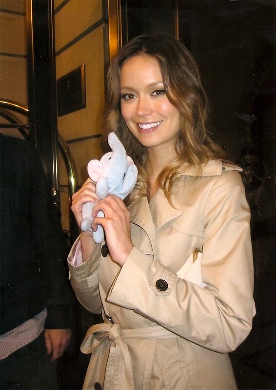 woman holding a stuffed elephant