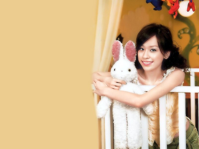 woman holding a stuffed rabbit