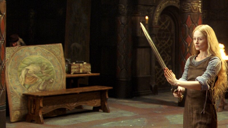 woman holding a sword in a castle