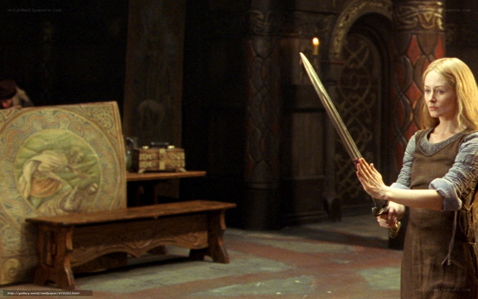 Woman holding a sword in a castle