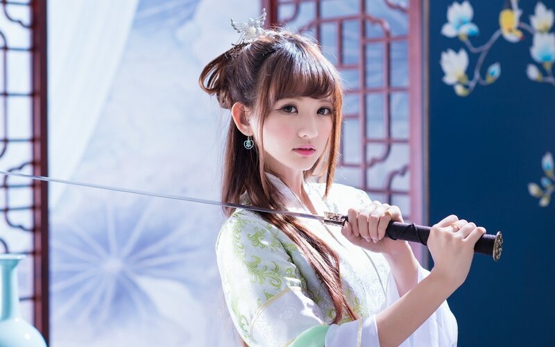 Woman Holding a Sword — White, Dramatic, Photograph