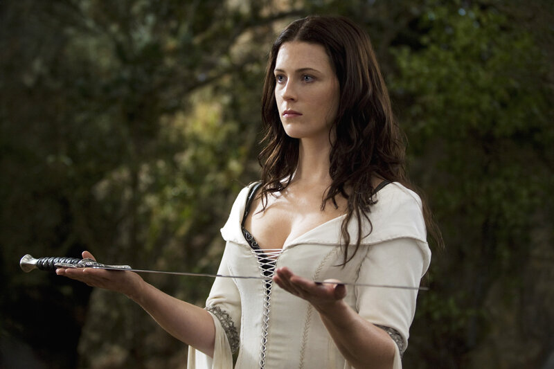 Woman Holding a Sword — White, Serious, Afternoon, Photograph, Forest