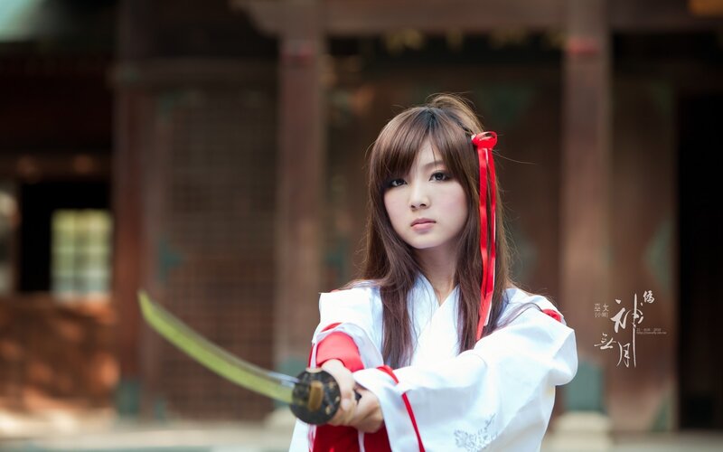 Woman Holding a Sword — White, Serious