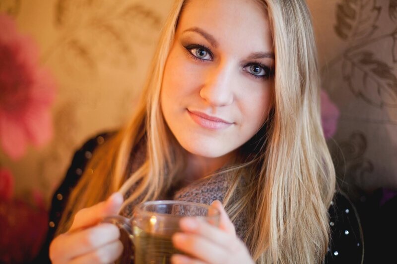 woman holding a tea cup