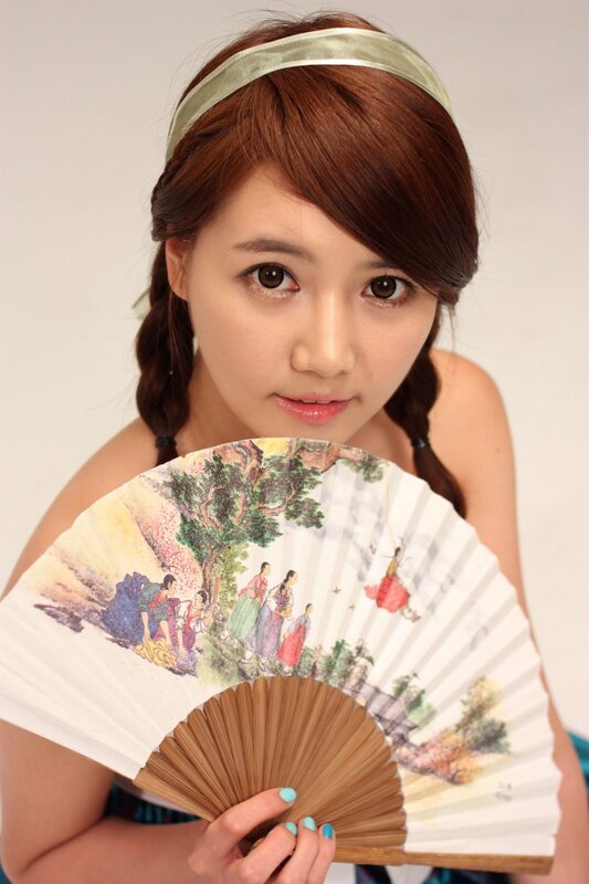 woman holding a traditional fan