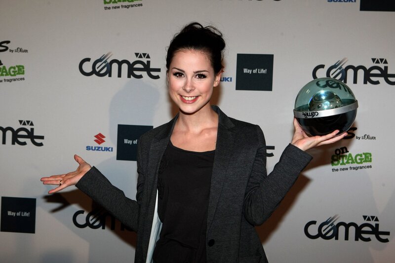 woman holding a trophy
