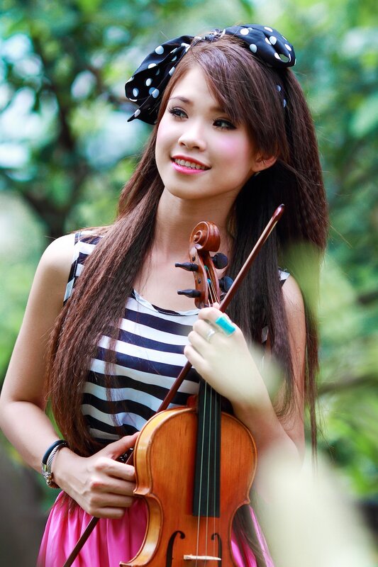 woman holding a violin