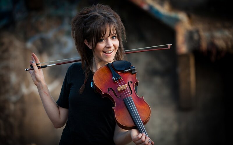 woman holding a violin