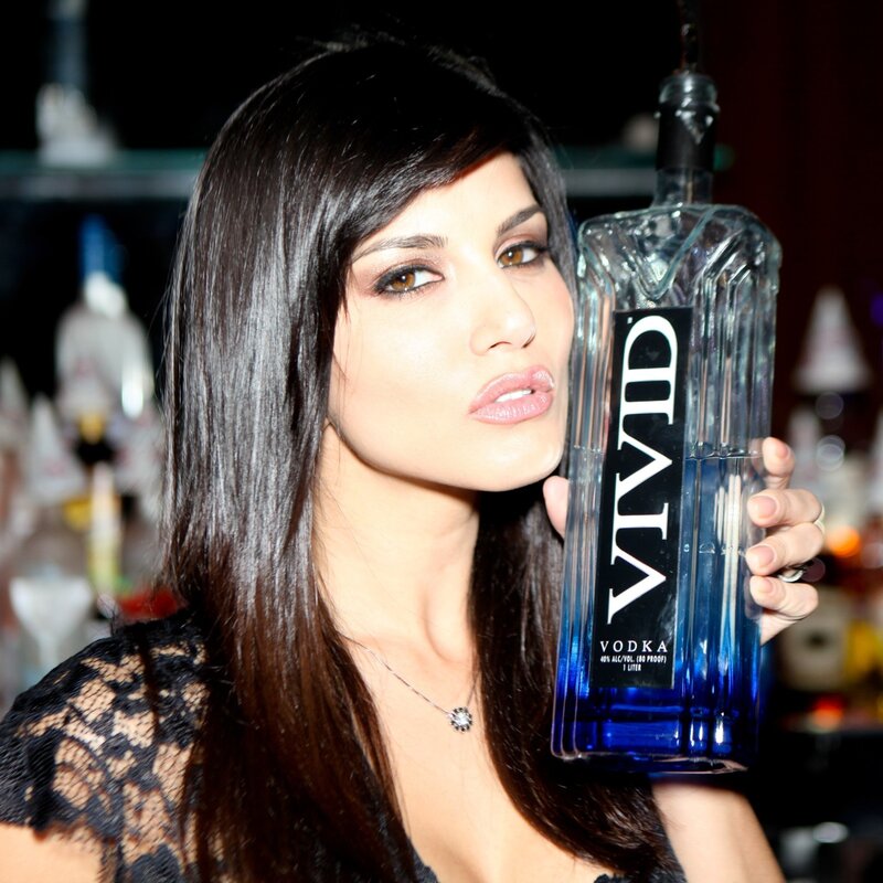 Woman holding a vodka bottle