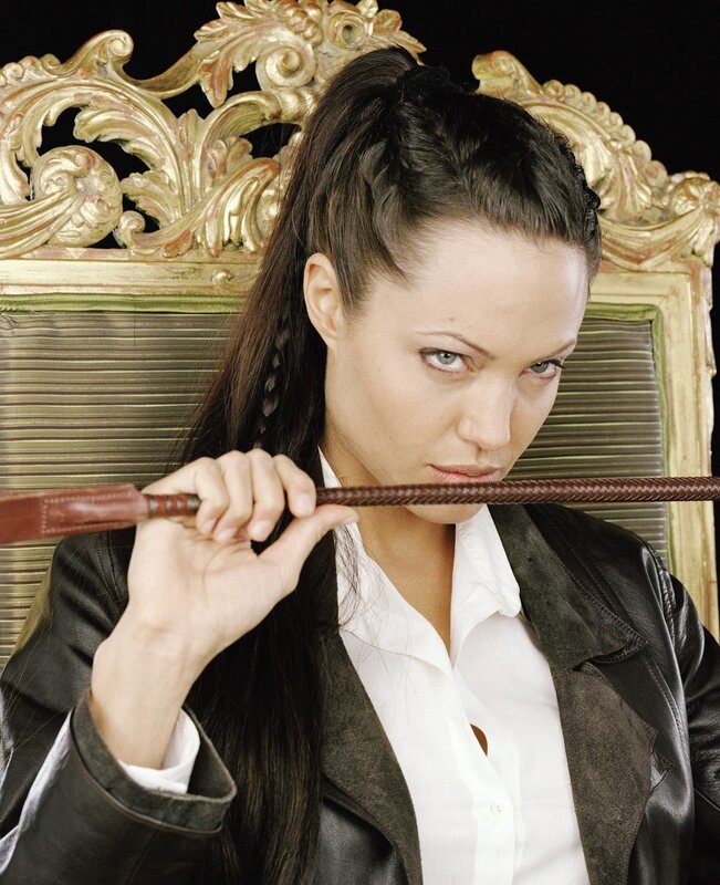 Woman holding a whip