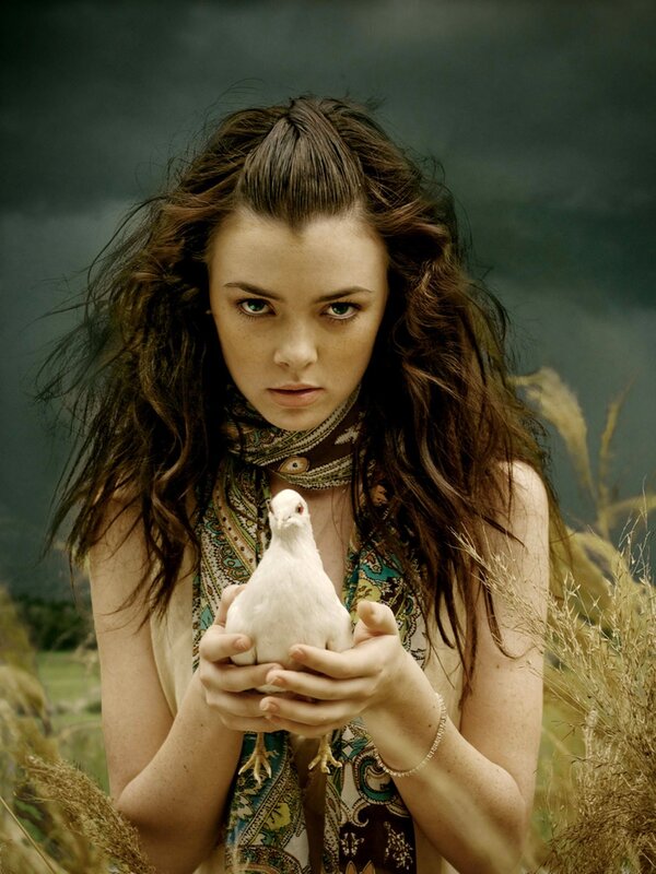 woman holding a white bird