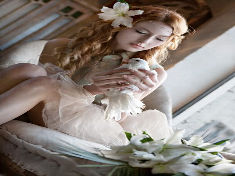 woman holding a white dove