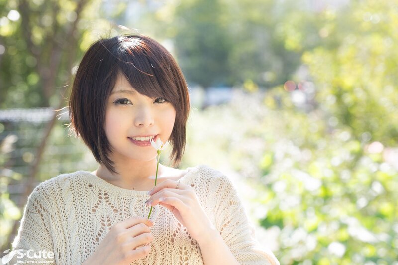 Woman holding a white flower