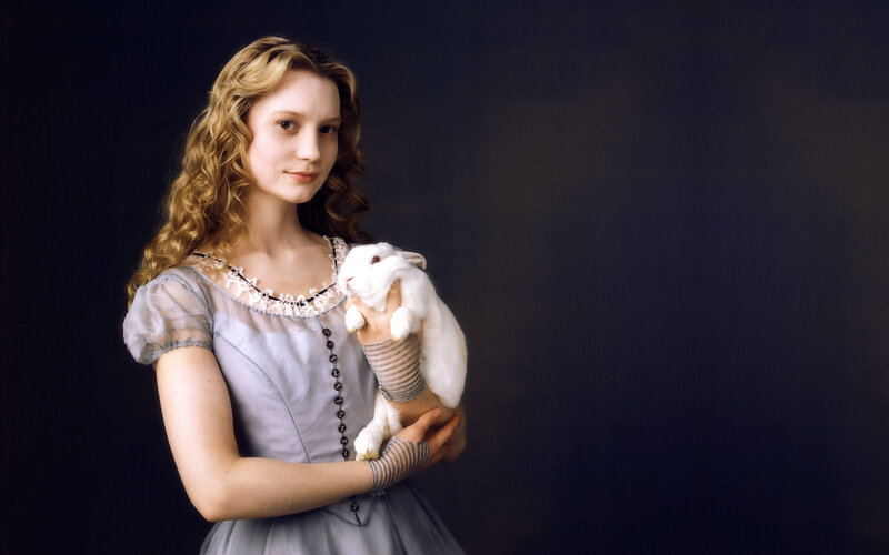 woman holding a white rabbit