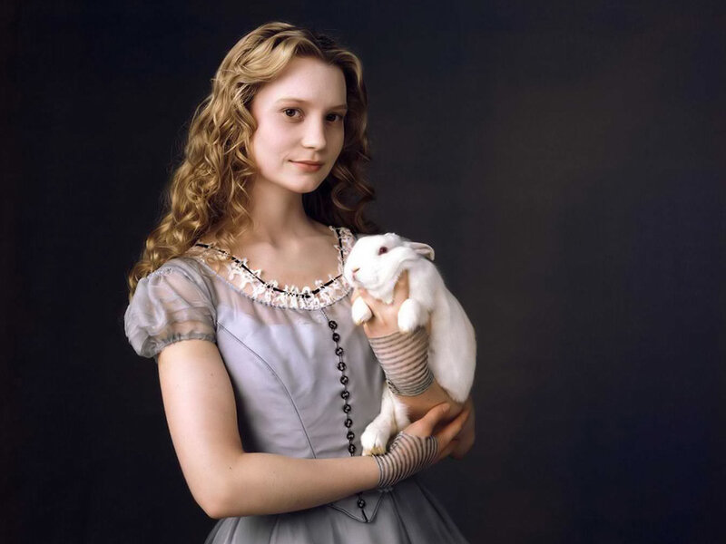 woman holding a white rabbit