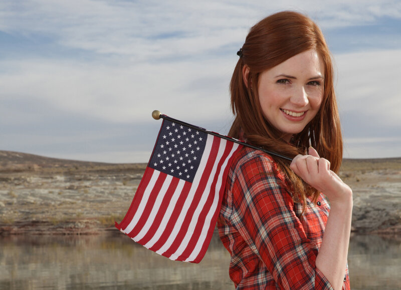 woman holding american flag