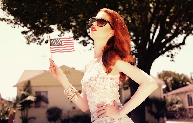 Woman holding American flag