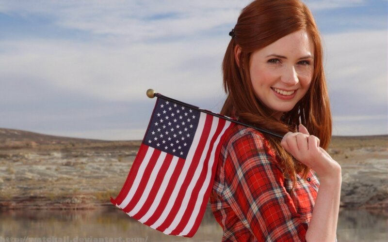 woman holding american flag