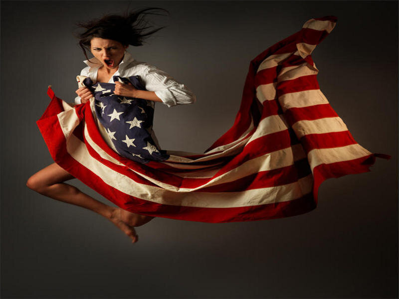Woman holding American flag