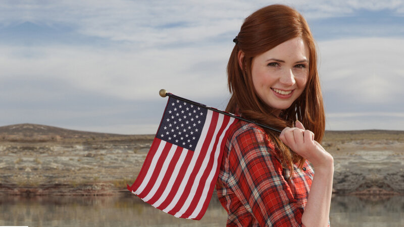 Woman holding American flag