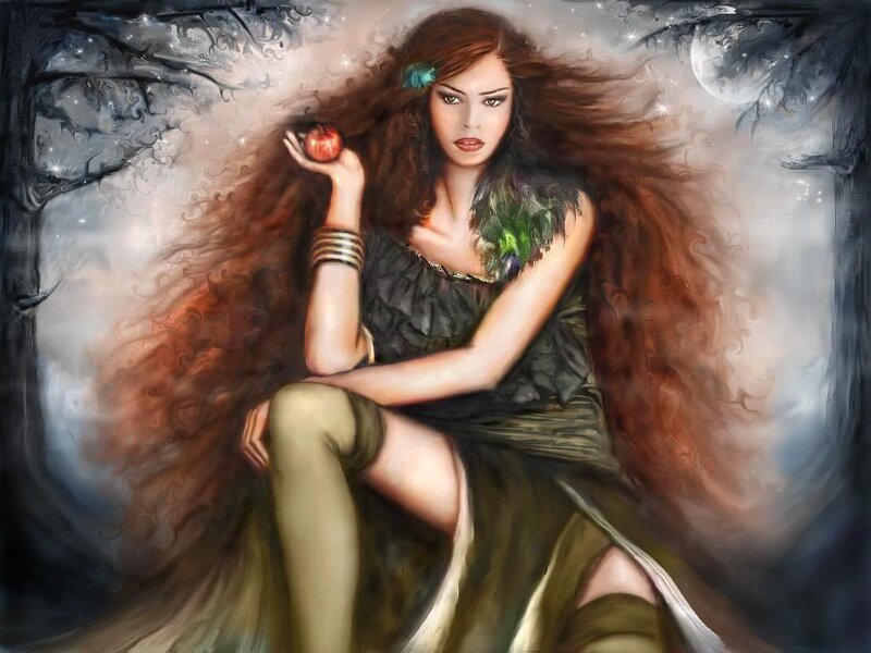 Woman holding an apple in a forest