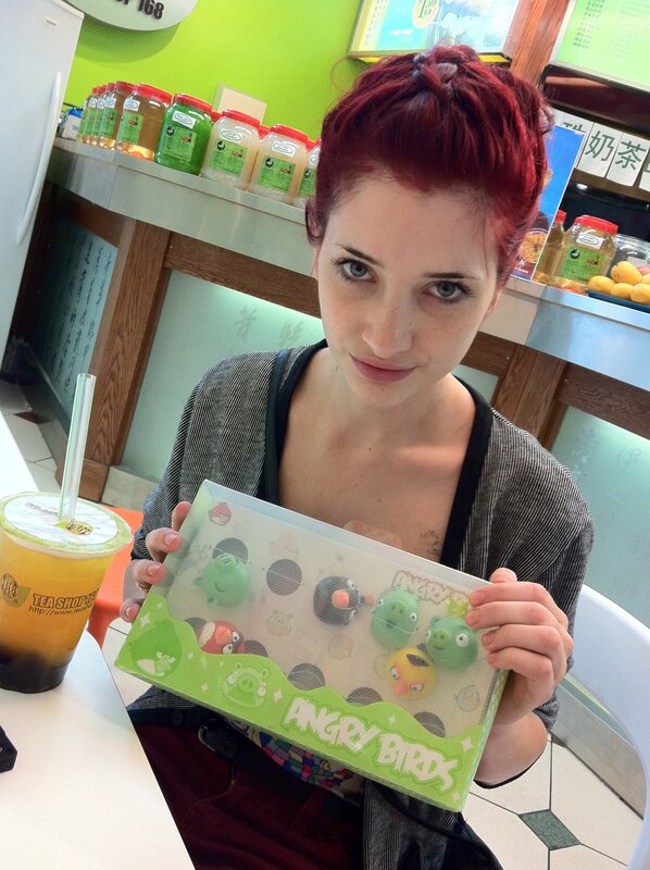 woman holding angry birds toy