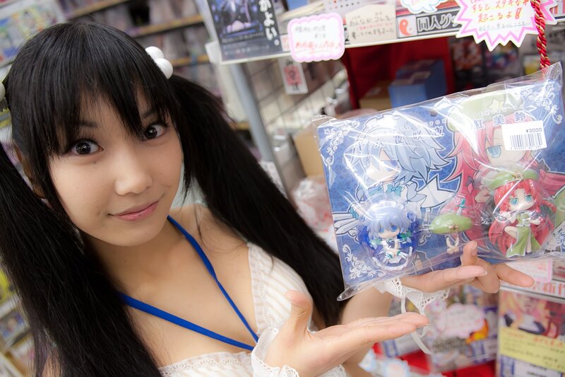 woman holding anime figures
