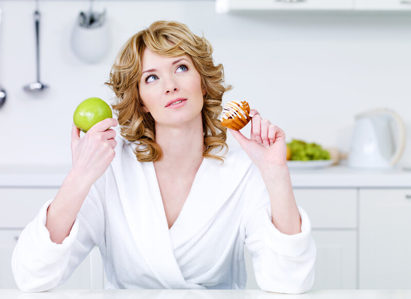 Woman Holding Apple and Pastry
